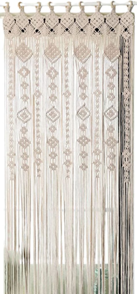 A macrame curtain hanging in a doorway or window.