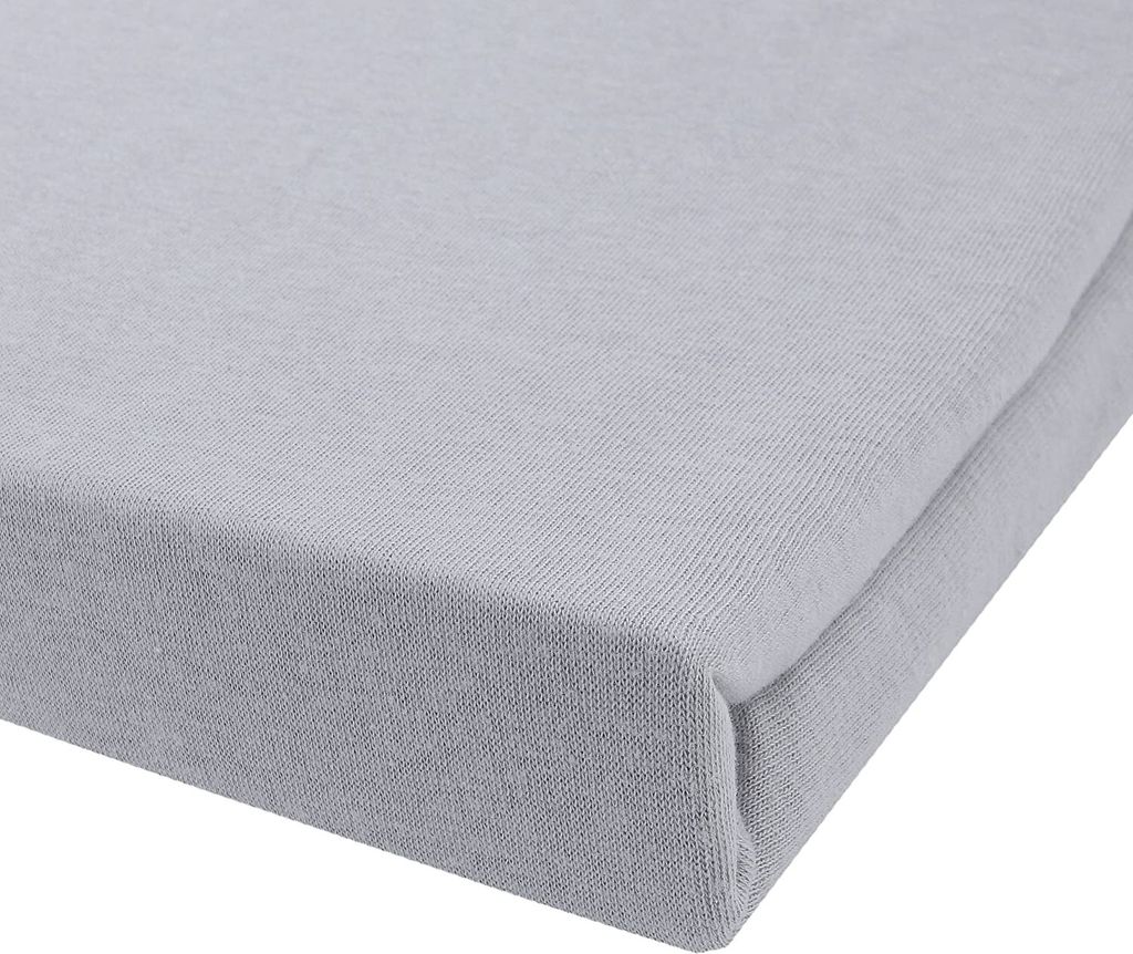 A close-up view of a light gray fitted sheet, showing the texture of the fabric and the corner seam.