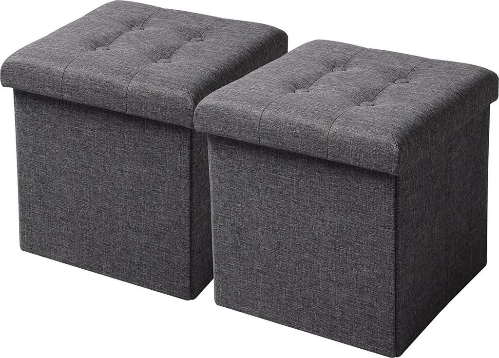 Two dark gray storage ottomans are shown side by side against a white background.