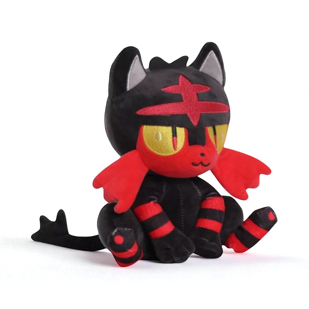 A plush toy of a Pokémon character sitting on a white background.