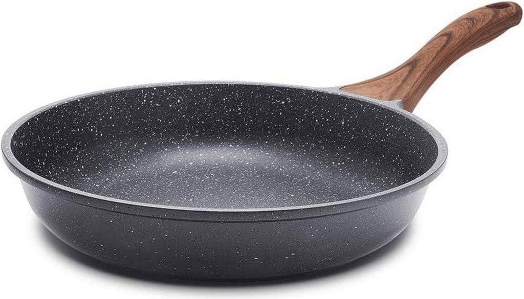 A frying pan with a wooden handle is shown against a white background.