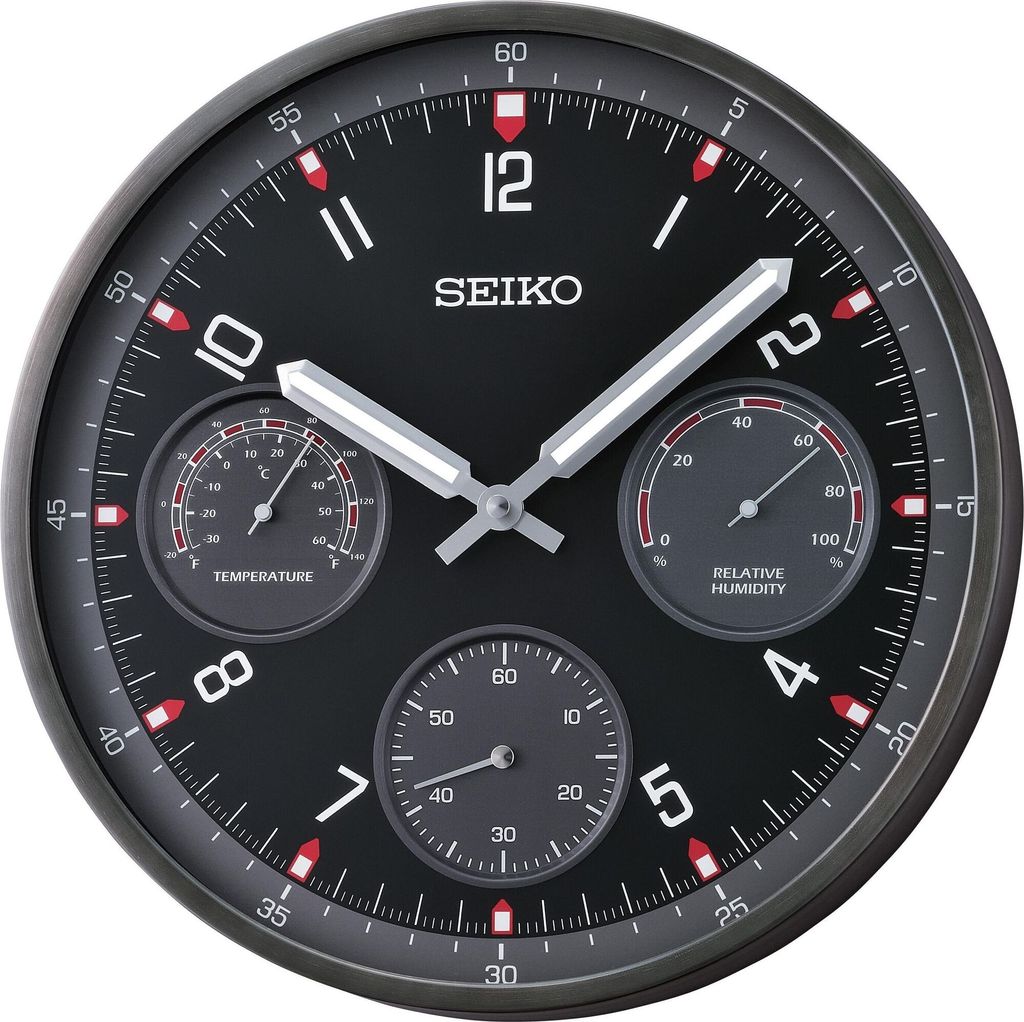 A close-up studio shot of a Seiko wall clock with integrated thermometer and hygrometer.