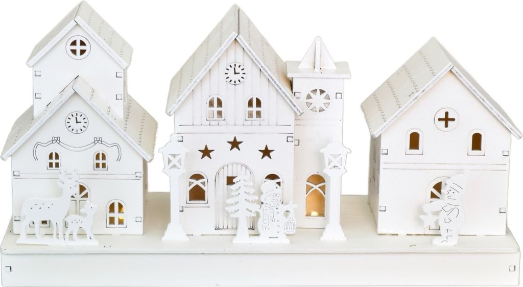 A set of white wooden Christmas houses with LED lights.