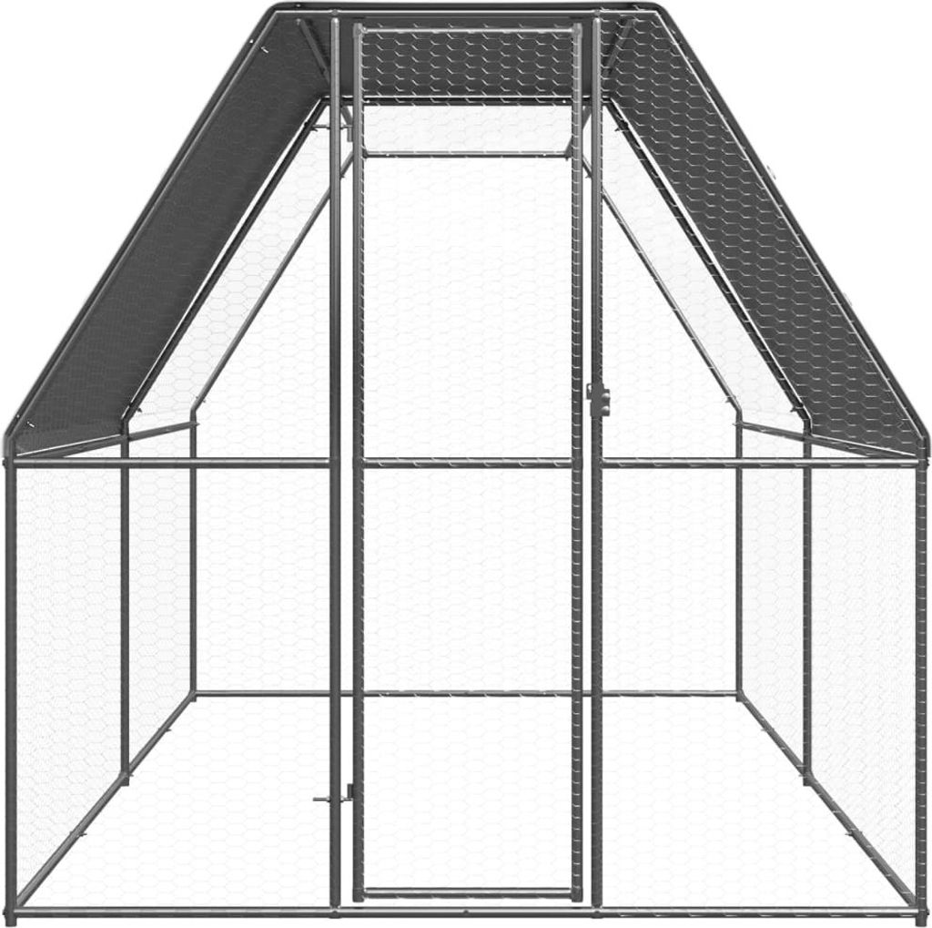 An empty, gray metal chicken coop with a peaked roof and a door in the center.