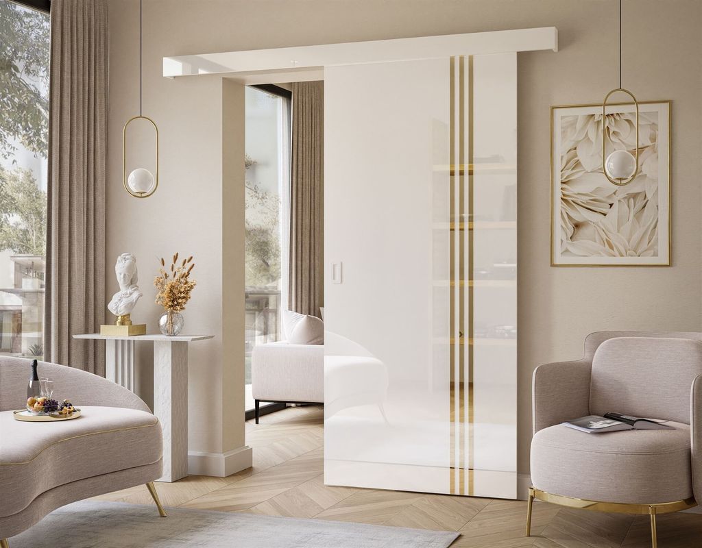 A modern living room with a sleek white sliding door with gold accents.
