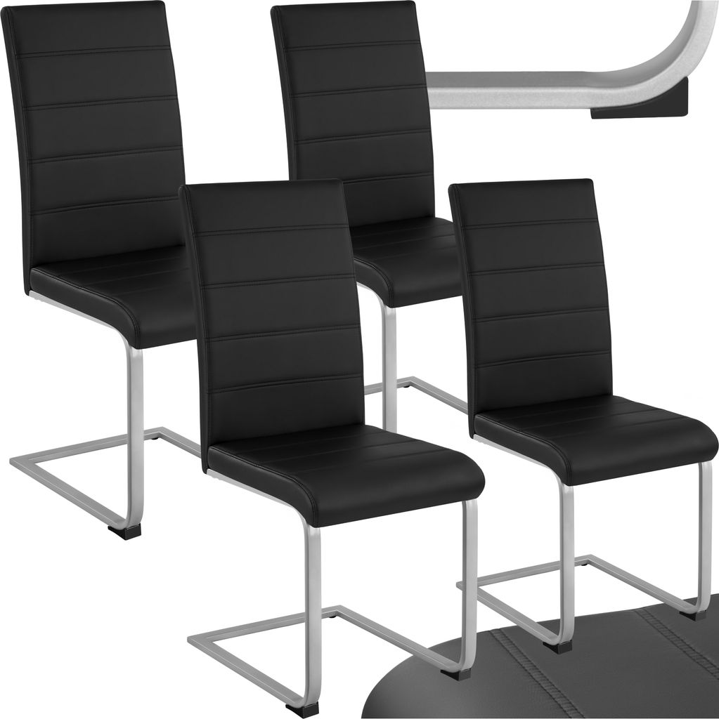 A set of four black dining chairs with chrome cantilever bases.