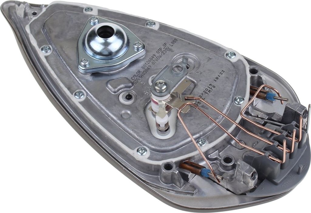 The underside of an iron soleplate with internal heating and steam components.
