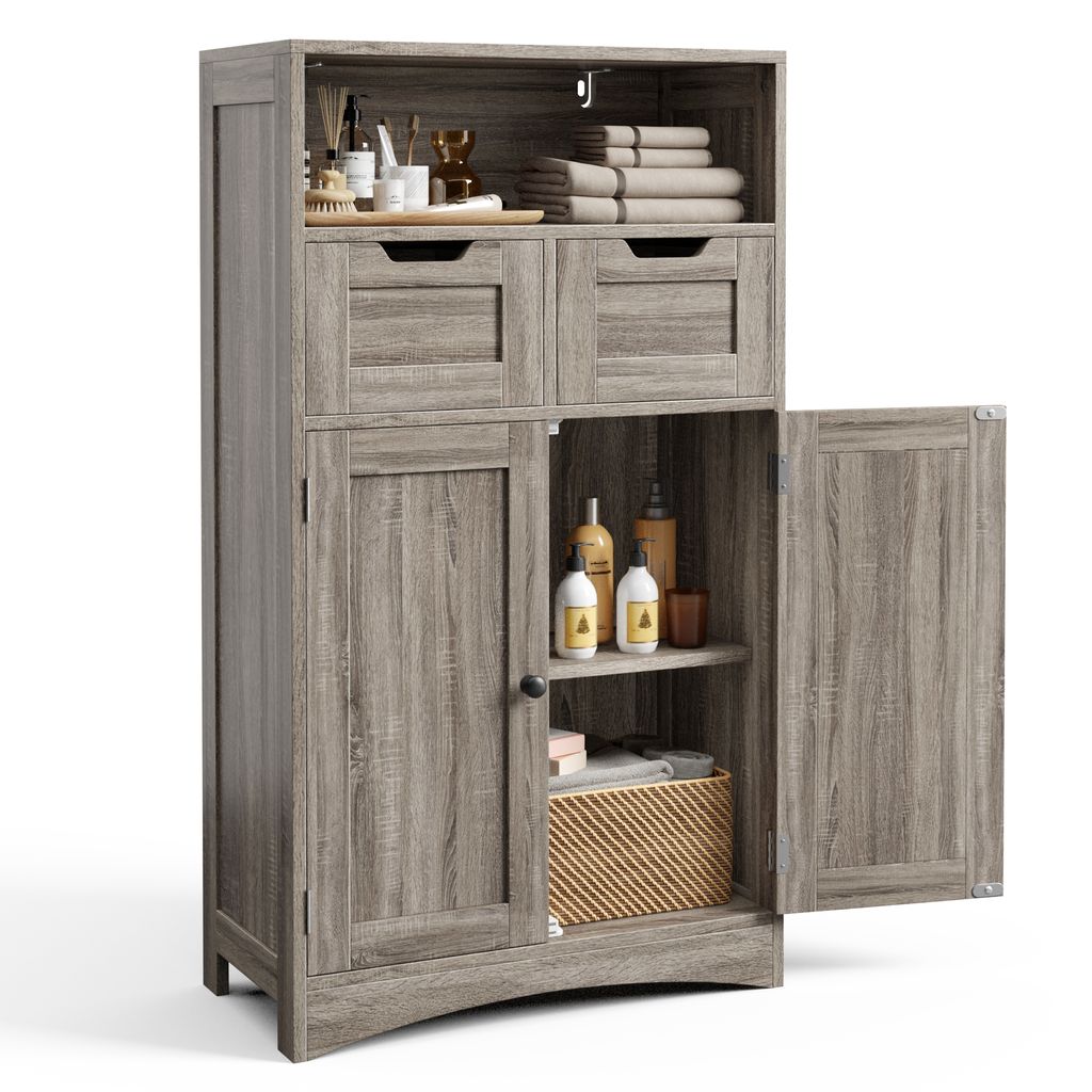 A tall, narrow cabinet with two doors and two drawers, made of wood-like material, is shown against a white background. The cabinet is open, revealing shelves with various items like bottles and towels.