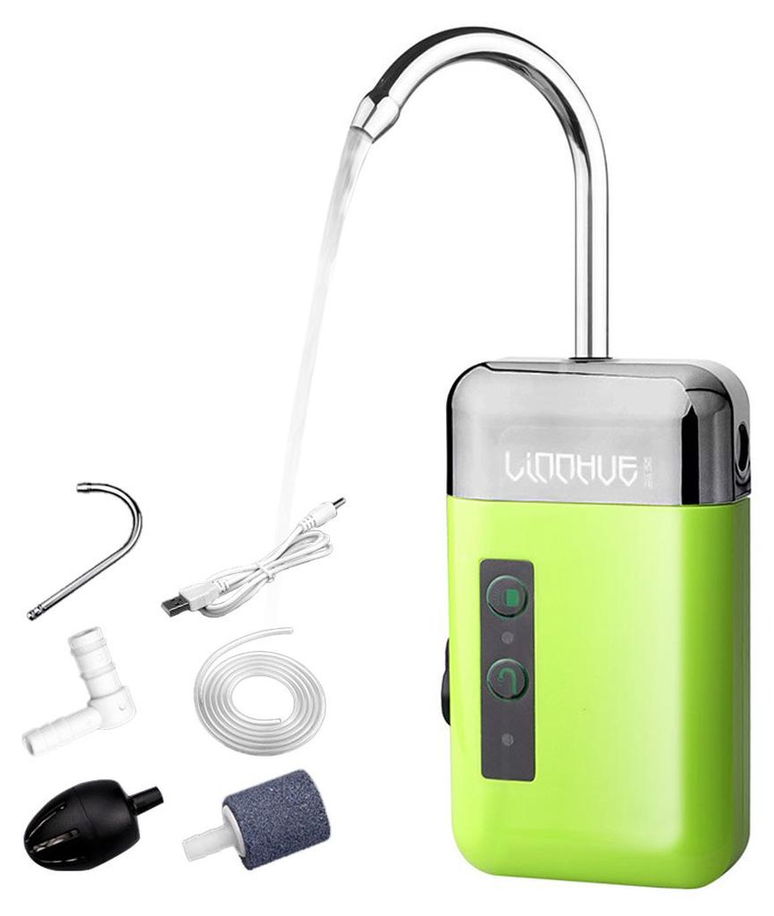 A green and silver automatic water pump with various accessories laid out beside it, with a stream of water flowing from its spout.