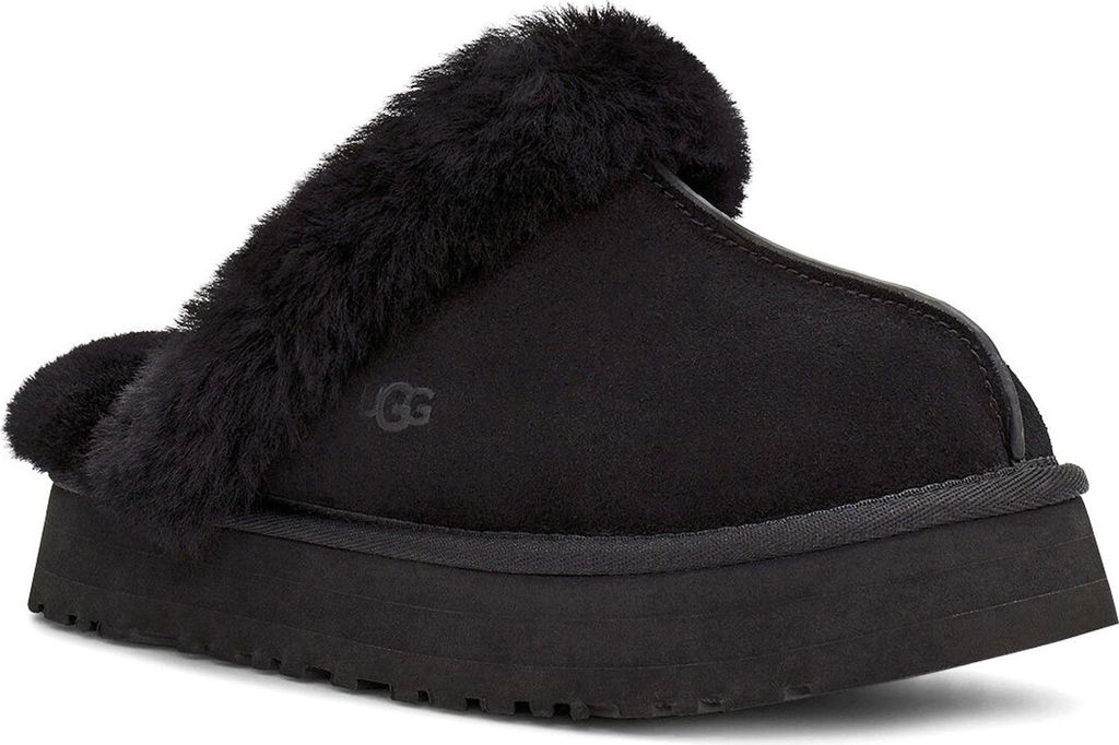 A black UGG slipper with fur trim on a white background.