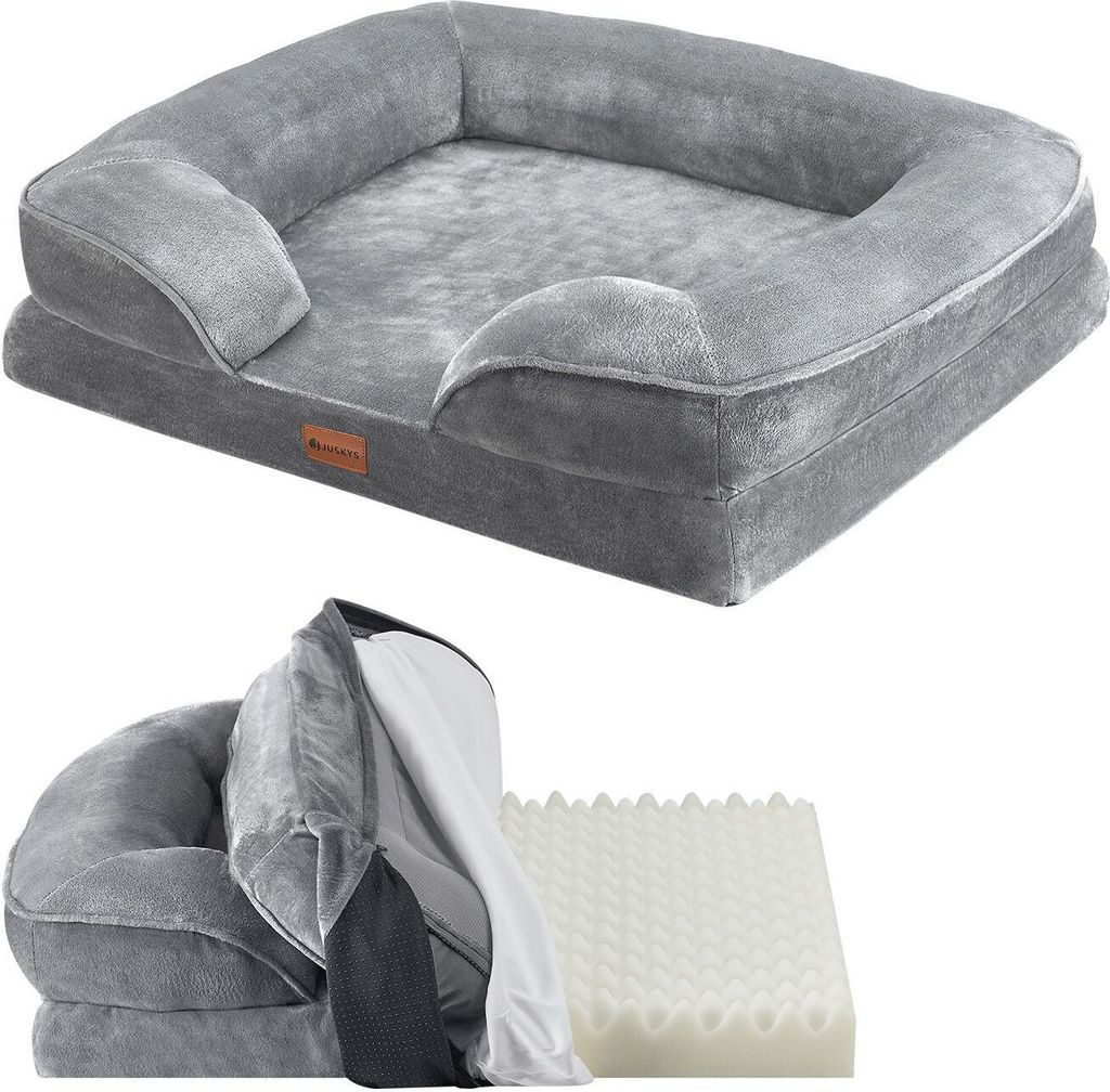 A grey orthopedic dog bed is shown from a slightly elevated angle, with a disassembled view of the bed showing its internal foam and cover below.