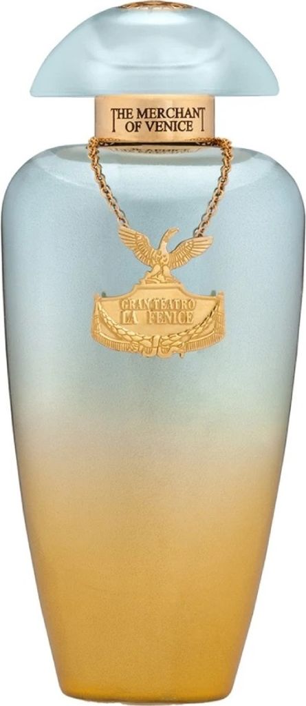 A perfume bottle with a gold chain and emblem.