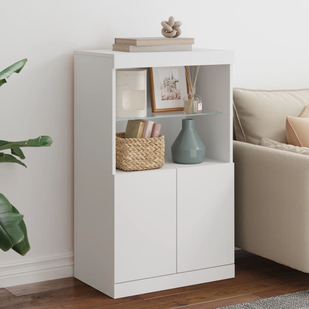 A white cabinet with shelves, decorated with books, a picture frame, a vase, and a basket, placed next to a sofa.