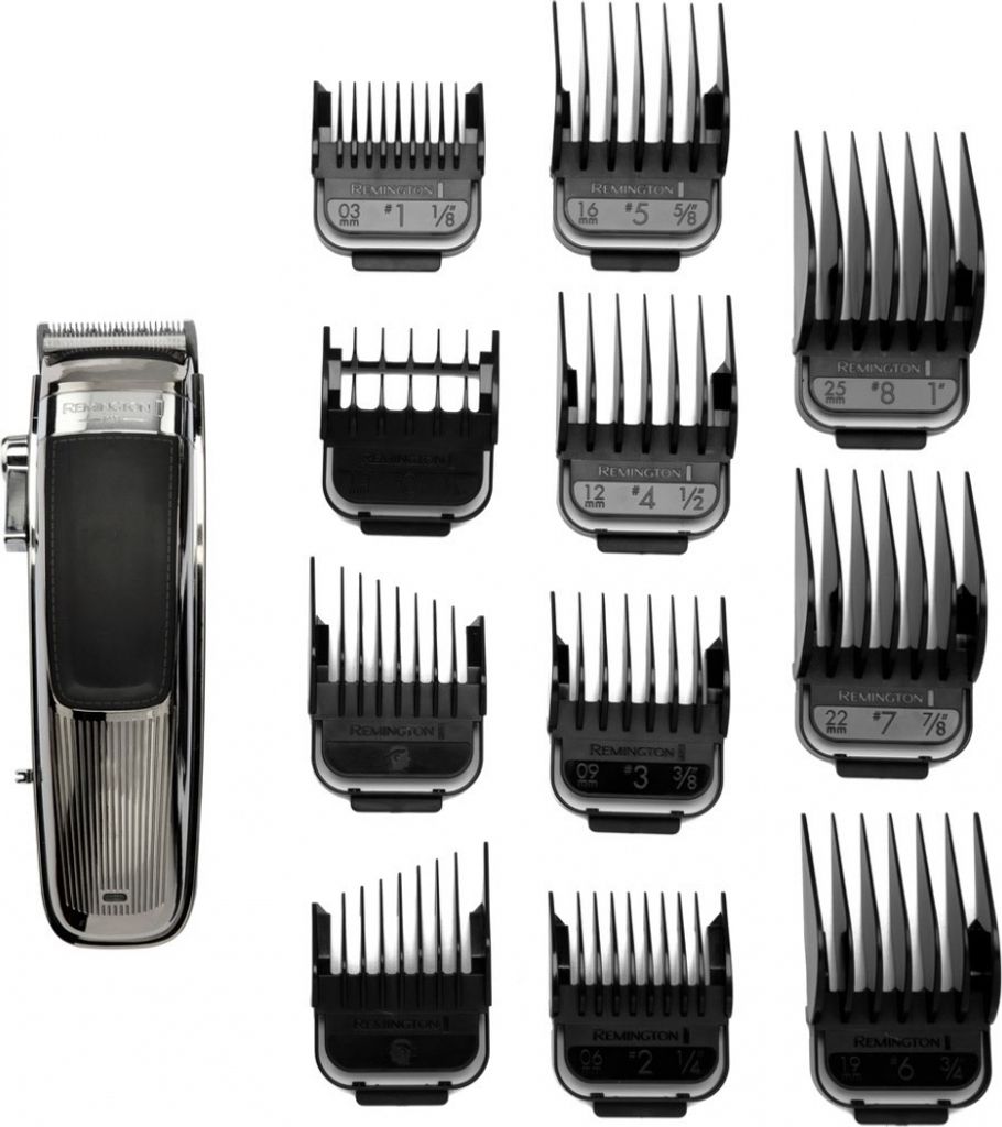 A hair clipper and its attachments are laid out on a white background.