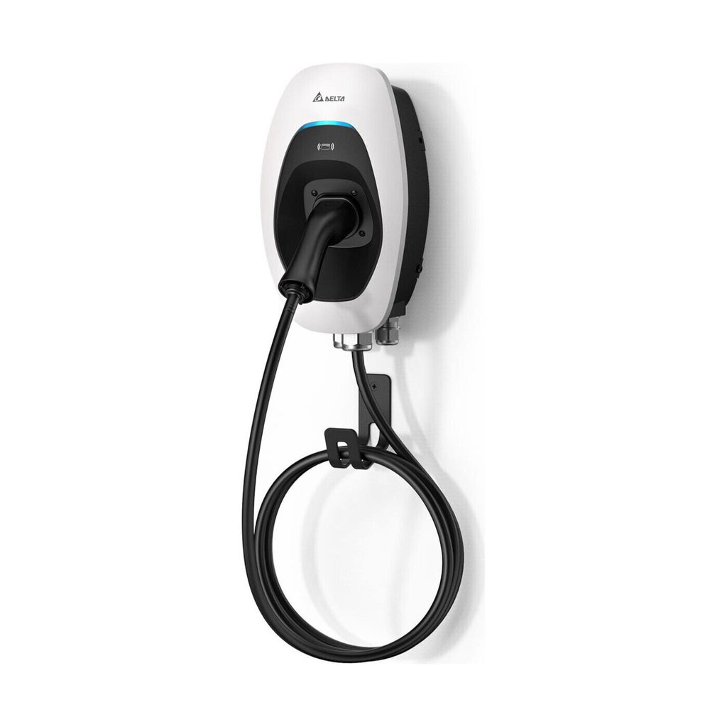 A white and black electric vehicle charging station mounted on a white wall, with its charging cable neatly coiled on a holder.