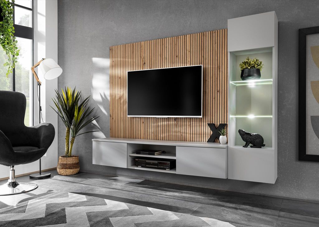 A modern living room with a wall-mounted entertainment unit.