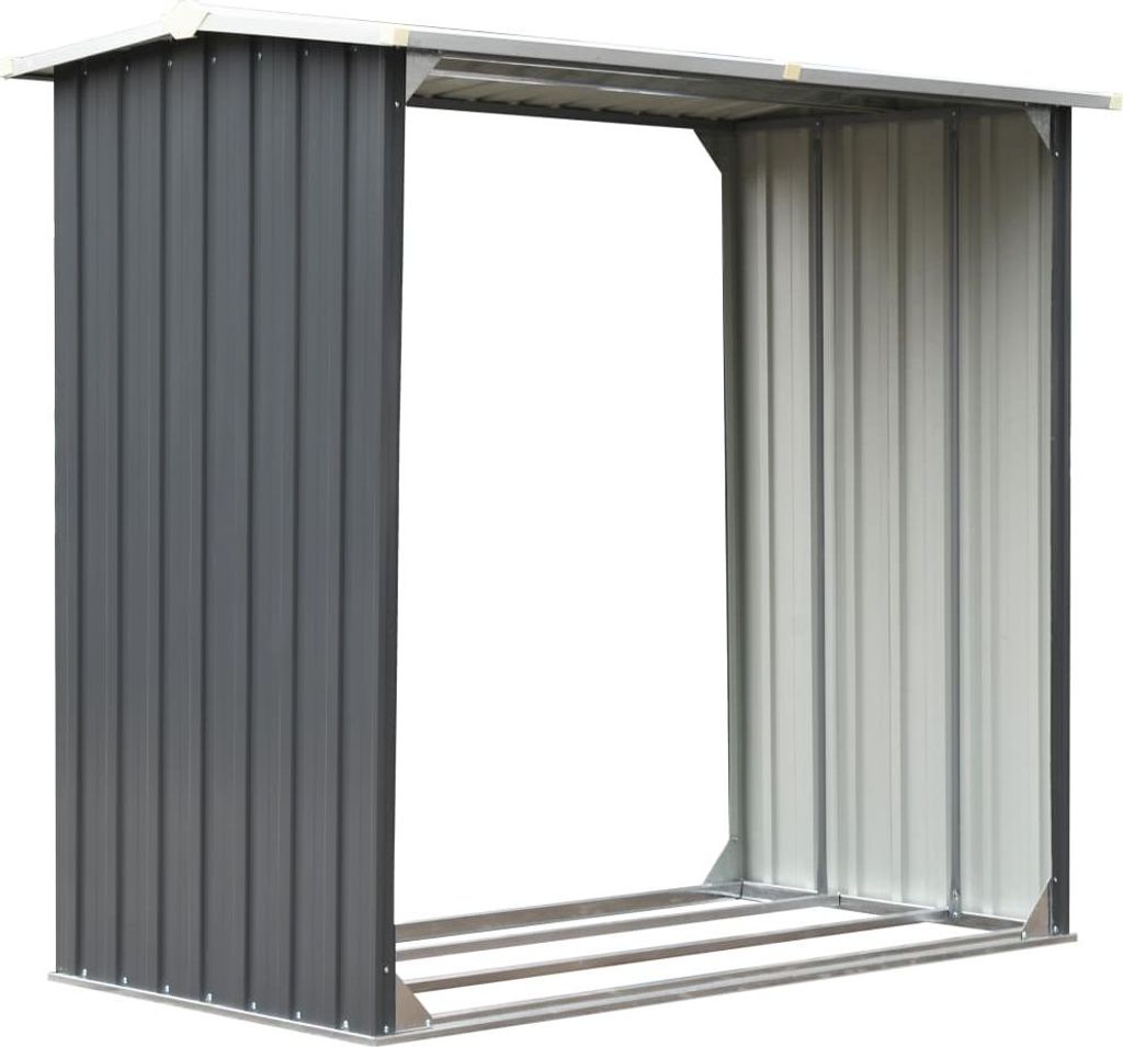 An empty metal log store with a sloped roof.