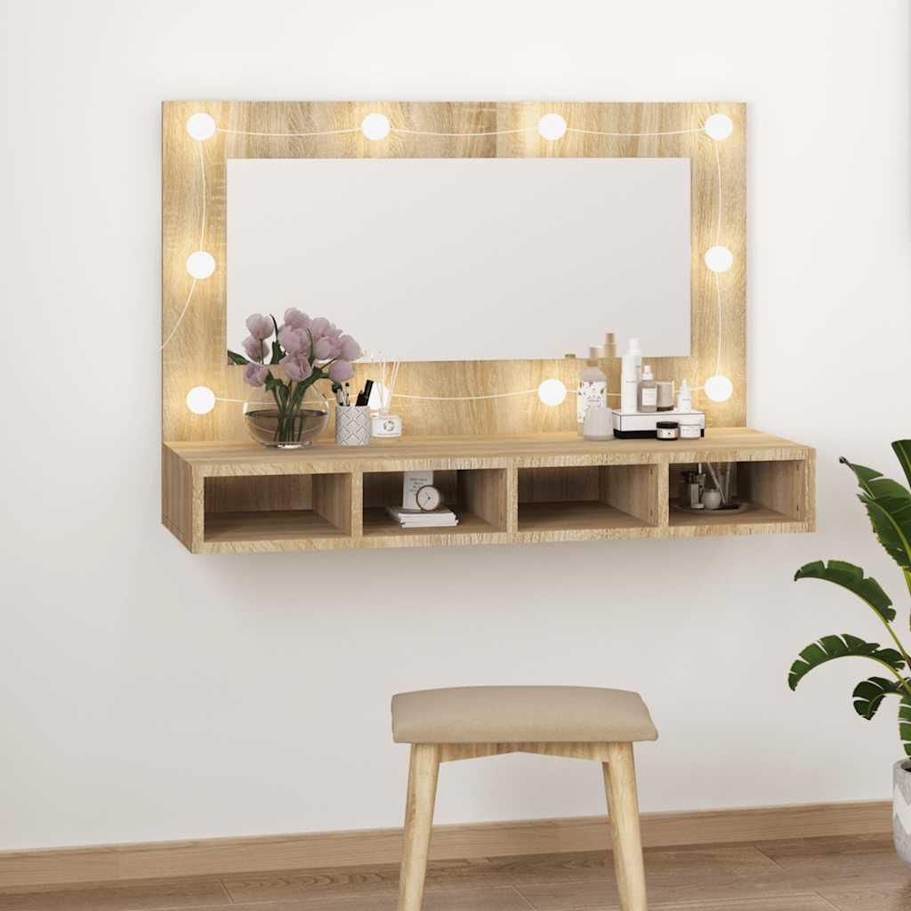 A vanity mirror with LED lights and storage shelves mounted on a white wall, with a stool in front.