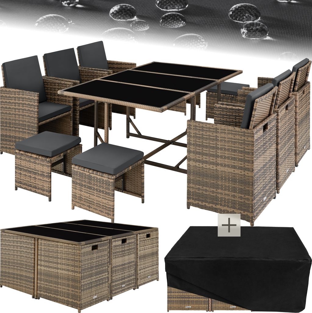 A rattan outdoor furniture set with a table, chairs, and ottomans, along with a protective cover.