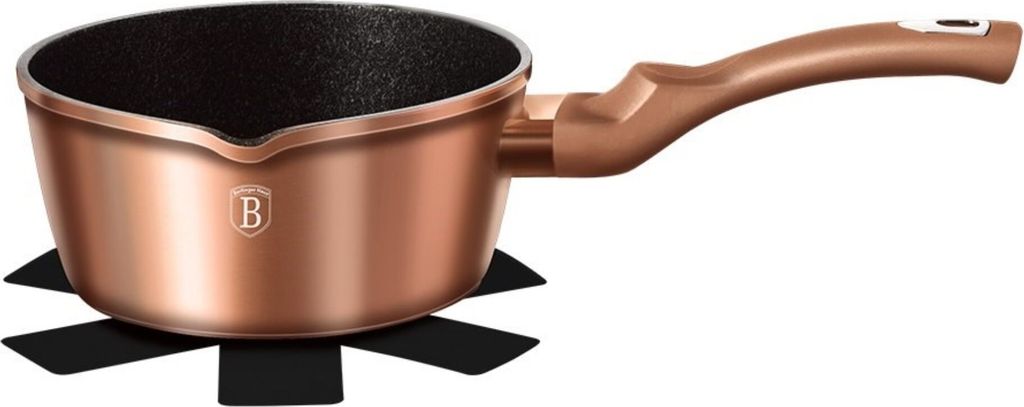 A copper pot with a black interior and a black base, isolated on a white background.