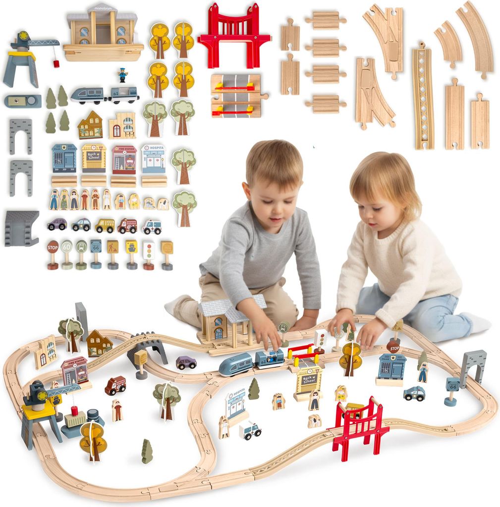 Two young children playing with a wooden train set on the floor.