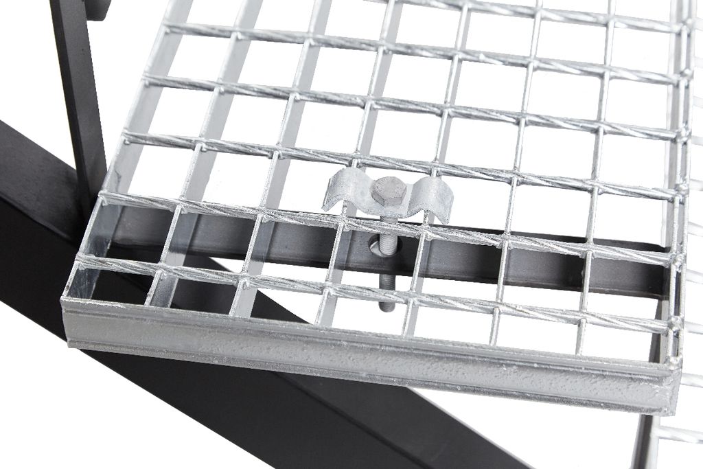 A close-up view of a metal grate with a bolt and wingnut securing it to a black metal frame.