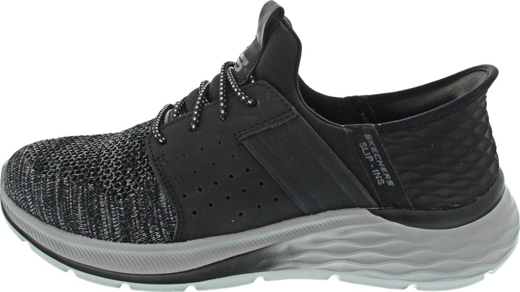 Side view of a black and gray athletic shoe.