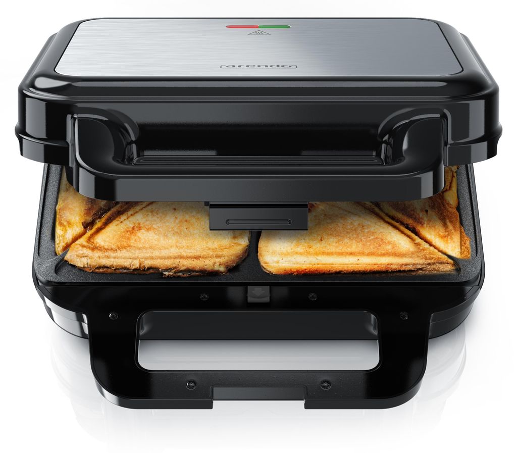 A close-up view of an open sandwich maker with two toasted sandwiches inside.