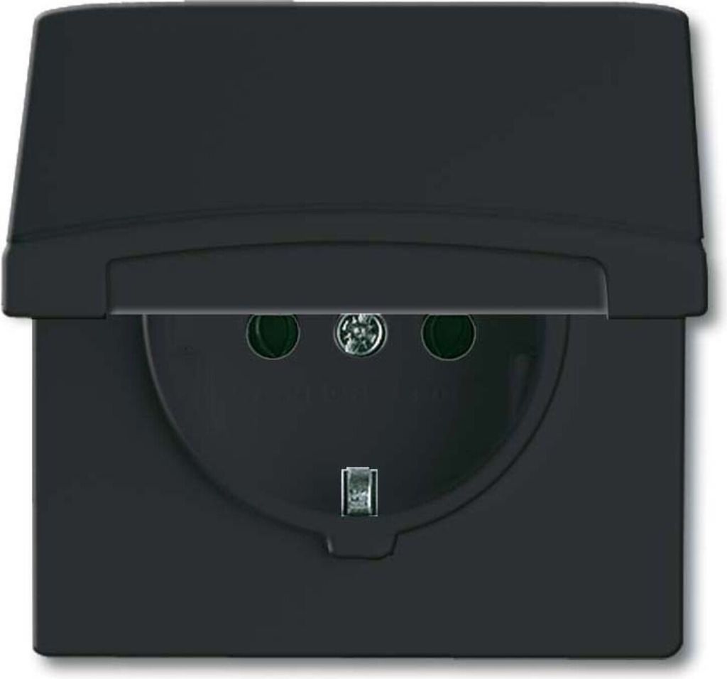 A black electrical socket with a flip-up cover.