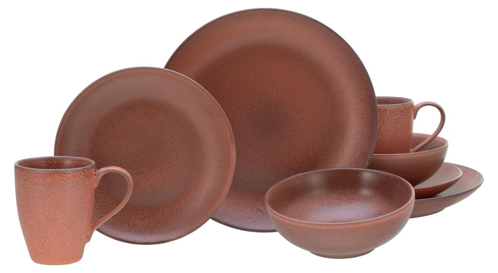 A set of earthenware dishes, including plates, bowls, and mugs, are arranged on a white background.