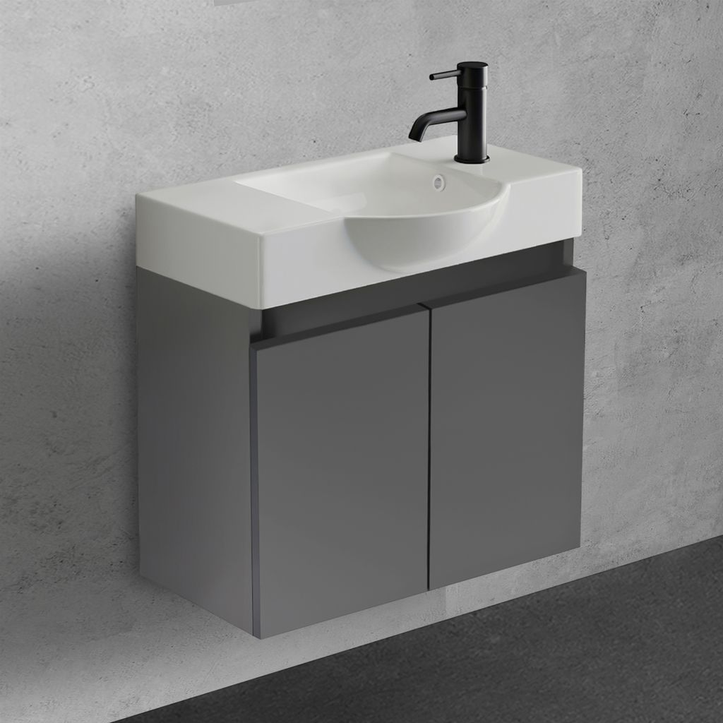 A modern wall-mounted bathroom vanity with a sink and faucet against a textured gray wall.