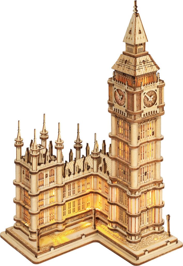 A 3D wooden model of Big Ben with lights illuminated.