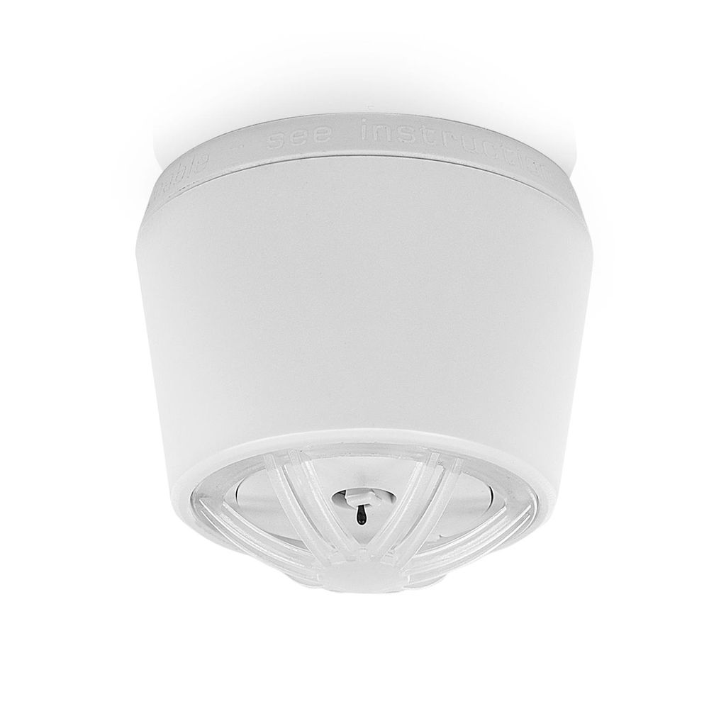 A white smoke detector mounted on a white ceiling.