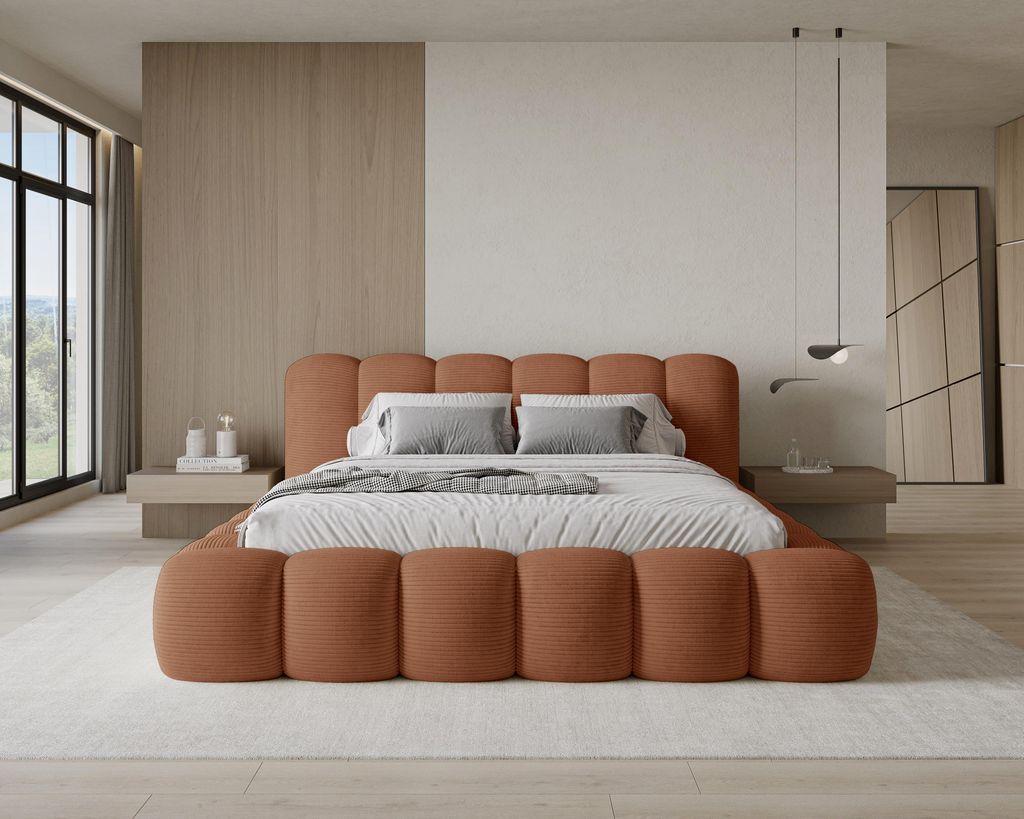 A modern bedroom with a large upholstered bed.