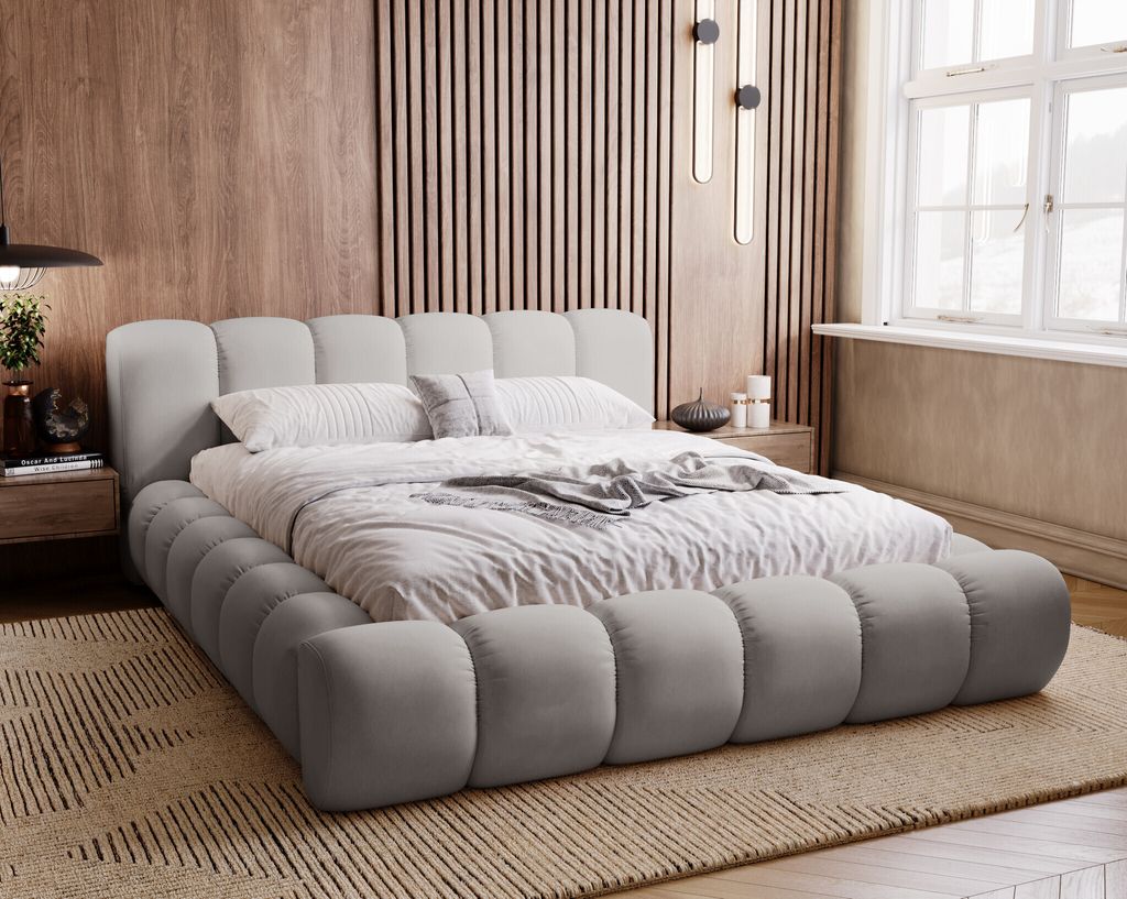 A stylish bedroom with a modern upholstered bed.