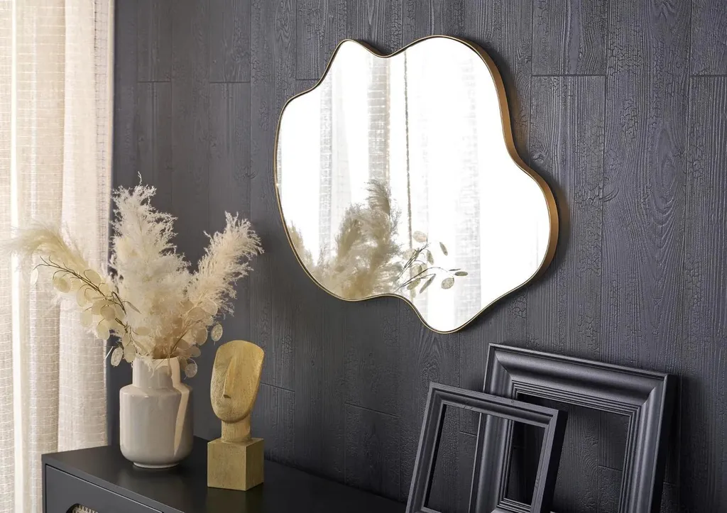 Miroir design ESSENT gold avec cadre fin doré pour une déco moderne