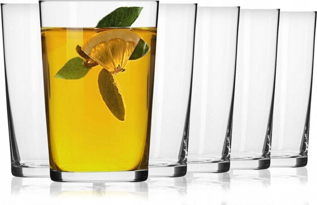 A set of clear glasses, one filled with a yellow beverage and garnished with lemon and mint leaves, arranged on a white background.