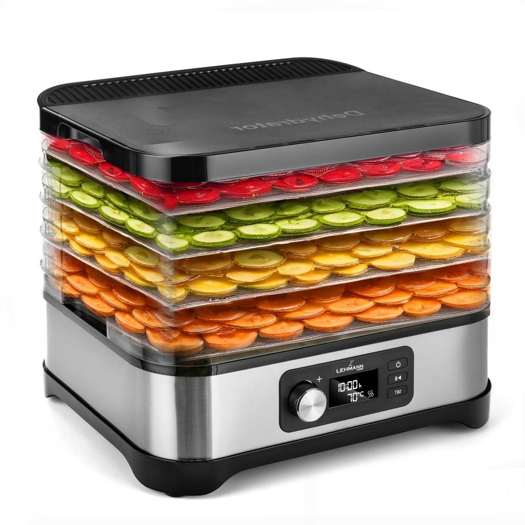 A food dehydrator with multiple trays filled with sliced fruits and vegetables.