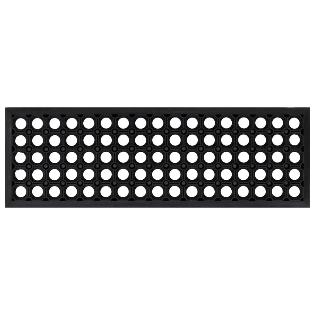 A black rubber mat with a grid of circular holes.