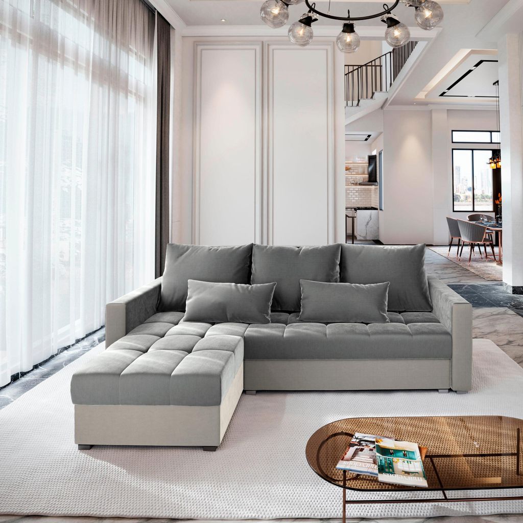 A modern living room with a sectional sofa and a coffee table.