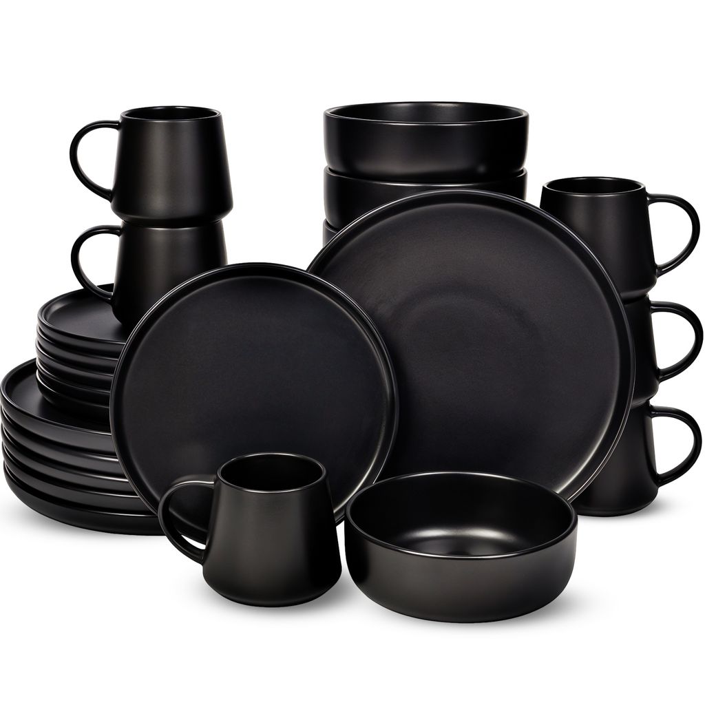 A collection of black ceramic dinnerware, including plates, bowls, and mugs, arranged on a white background.