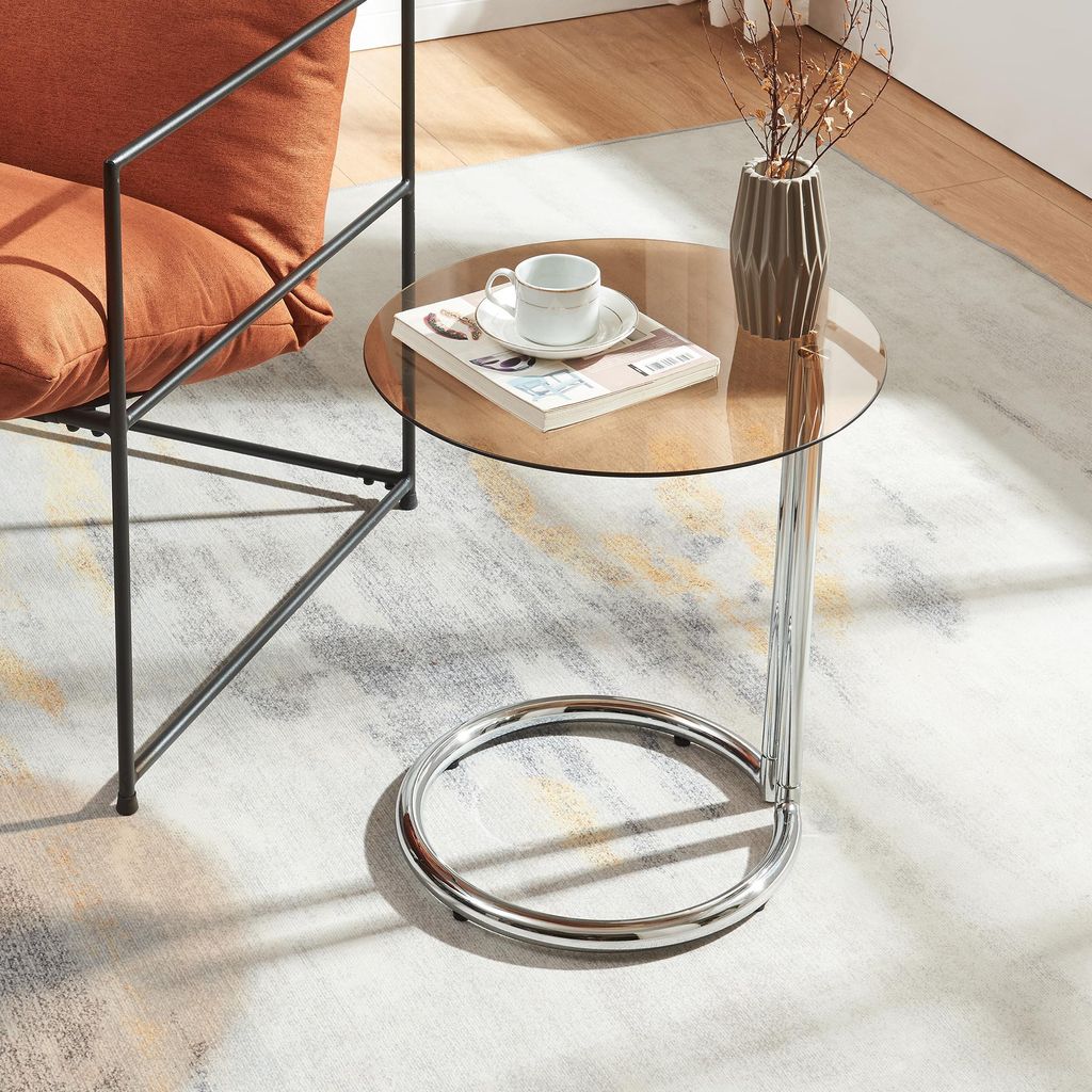 A modern living room setting with a chair and a side table.