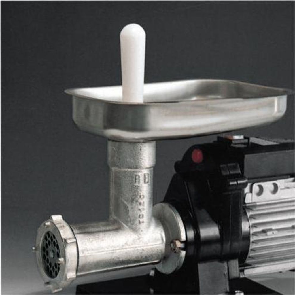 Close-up of a meat grinder with a stainless steel tray and a white pusher.