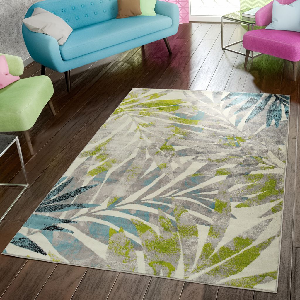 A living room scene with furniture and a rug.