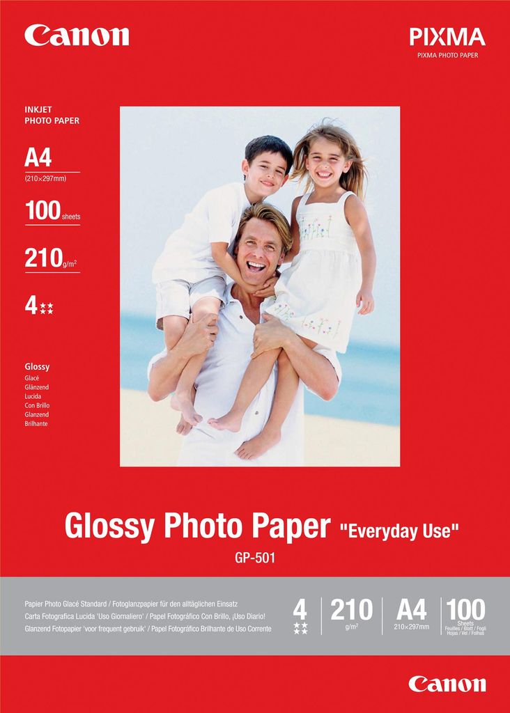 A family on a beach, with a product package in the foreground.
