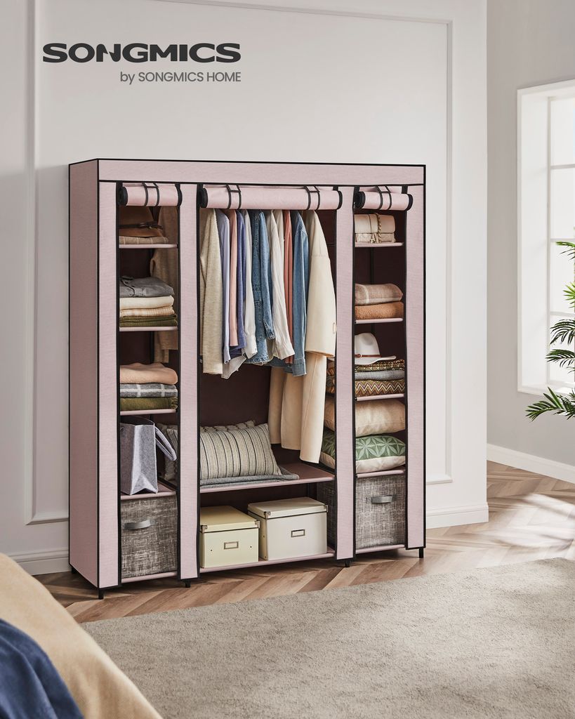 A pink fabric wardrobe with clothes hanging inside and shelves filled with folded clothes and storage boxes.