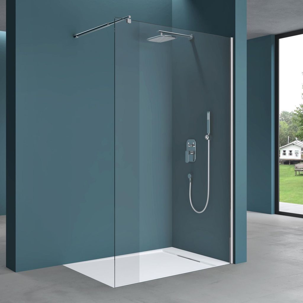 A modern walk-in shower enclosure with a glass wall, showerhead, and handheld shower.