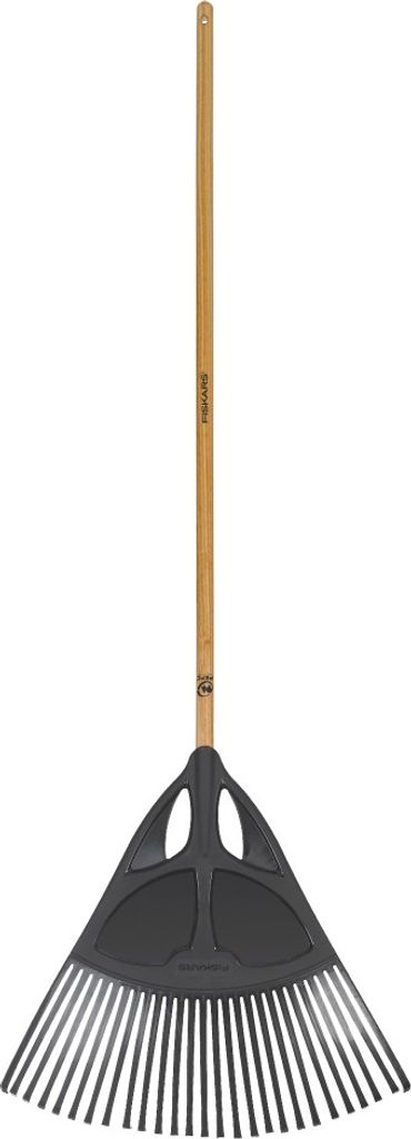 A Fiskars leaf rake against a white background.