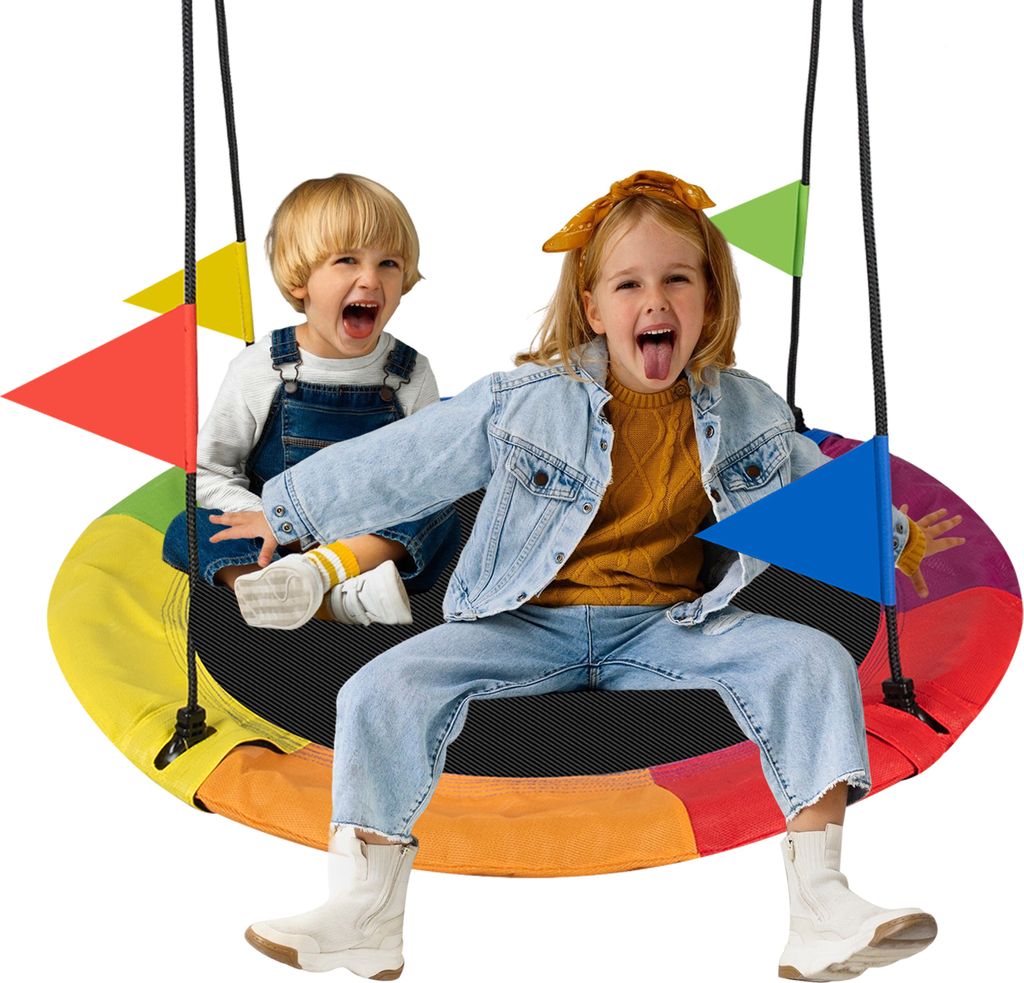 Two children are sitting on a rainbow-colored nest swing, with colorful flags attached to the ropes.