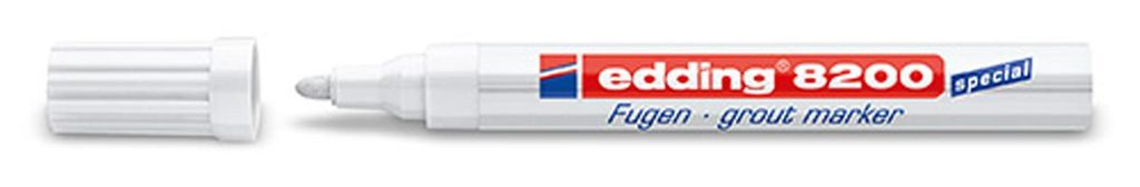 A white grout marker with its cap off, lying on a white background.